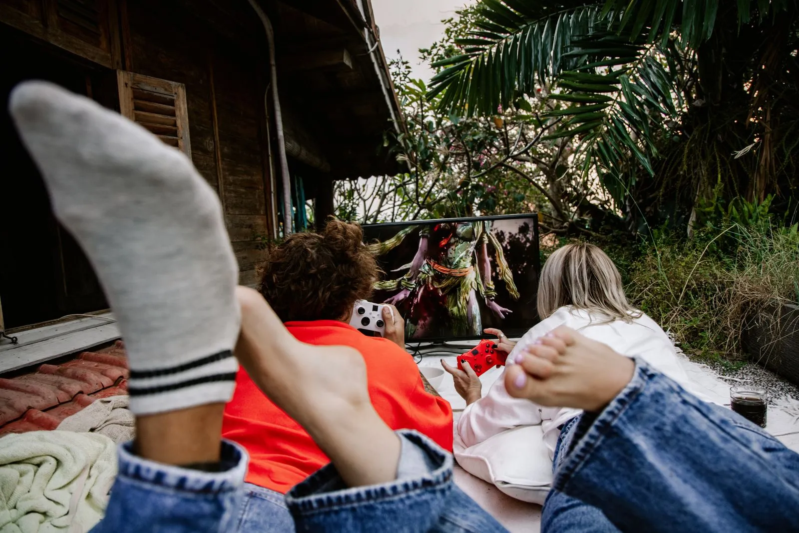 Friends enjoying an outdoor gaming session together, showcasing enjoyment and togetherness.